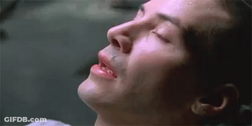 A Close Up Of A Man 'S Face With His Eyes Closed And Sweat Coming Out Of His Nose . GIF