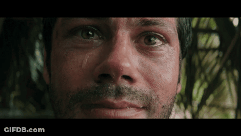 A Close Up Of A Man 'S Face With His Eyes Closed GIF