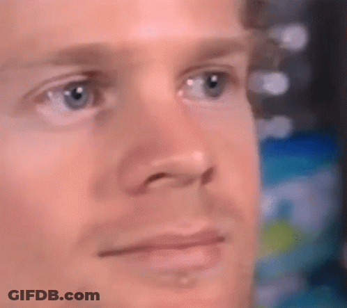 A Close Up Of A Man 'S Face With His Eyes Closed GIF