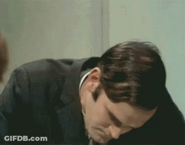 A Close Up Of A Man 'S Face With His Eyes Closed GIF