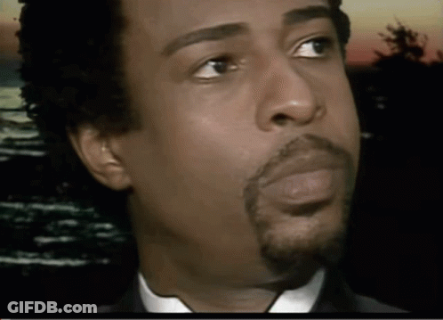 A Close Up Of A Man 'S Face With His Eyes Closed GIF