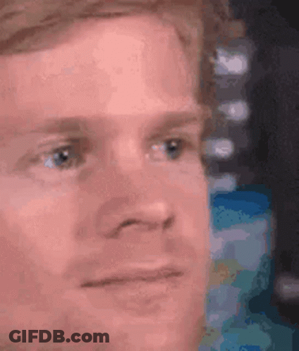 A Close Up Of A Man 'S Face With His Eyes Closed . GIF