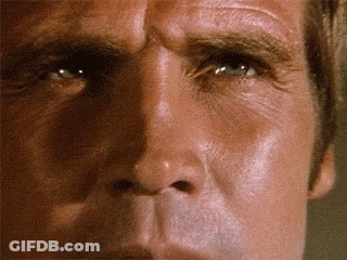 A Close Up Of A Man 'S Face With His Eyes Closed GIF