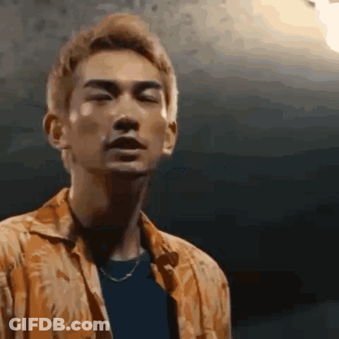 A Close Up Of A Man 'S Face With His Eyes Closed . GIF