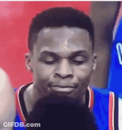 A Close Up Of A Man 'S Face With His Eyes Closed . GIF