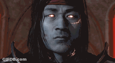 A Close Up Of A Man 'S Face With His Eyes Glowing GIF