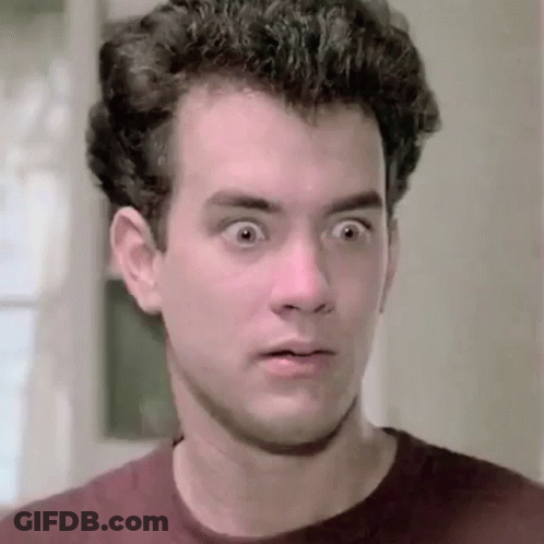 A Close Up Of A Man 'S Face With His Eyes Wide Open And A Surprised Look On His Face . GIF