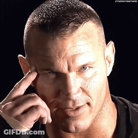 A Close Up Of A Man 'S Face With His Finger To His Forehead . GIF