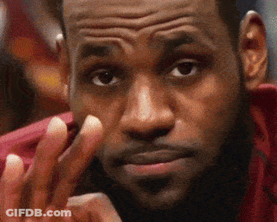 A Close Up Of A Man 'S Face With His Hand On His Chin GIF