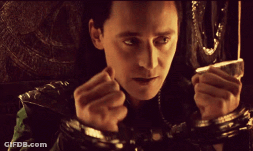 A Close Up Of A Man 'S Face With His Hands Behind His Back GIF