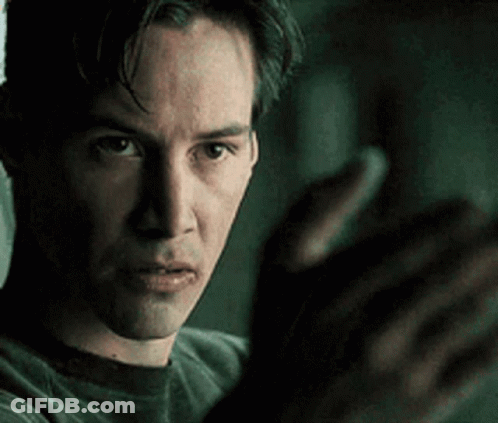 A Close Up Of A Man 'S Face With His Hands Outstretched In Front Of Him . GIF