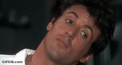 A Close Up Of A Man 'S Face With His Head Turned GIF