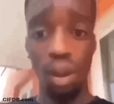 A Close Up Of A Man 'S Face With His Mouth Open And A Blurry Background . GIF