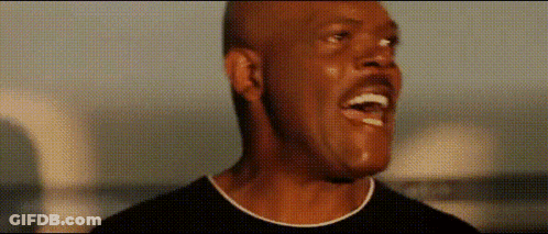 A Close Up Of A Man 'S Face With His Mouth Open And A Mustache . GIF