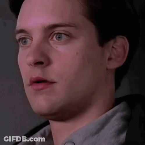 A Close Up Of A Man 'S Face With His Mouth Open And A Surprised Look On His Face . GIF