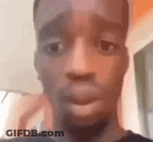 A Close Up Of A Man 'S Face With His Mouth Open And A Surprised Look On His Face . GIF