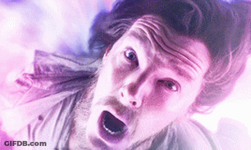 A Close Up Of A Man 'S Face With His Mouth Open And A Surprised Look On His Face . GIF