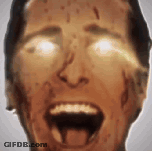 A Close Up Of A Man 'S Face With His Mouth Open And Blood Coming Out Of His Mouth . GIF