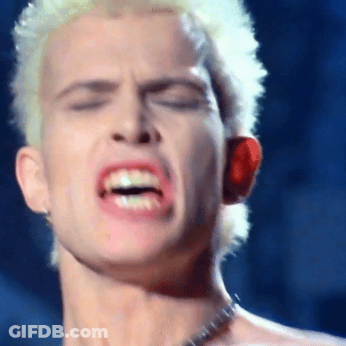 A Close Up Of A Man 'S Face With His Mouth Open And His Eyes Closed GIF