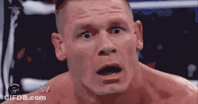 A Close Up Of A Man 'S Face With His Mouth Open And His Eyes Closed . GIF