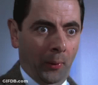 A Close Up Of A Man 'S Face With His Mouth Open And His Eyes Wide Open . GIF