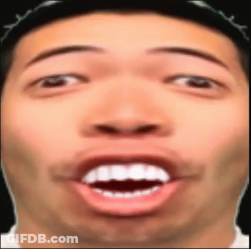 A Close Up Of A Man 'S Face With His Mouth Open And His Teeth Visible . GIF