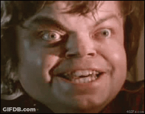 A Close Up Of A Man 'S Face With His Mouth Open And His Teeth Visible GIF