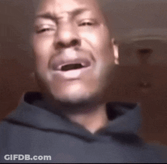 A Close Up Of A Man 'S Face With His Mouth Open GIF