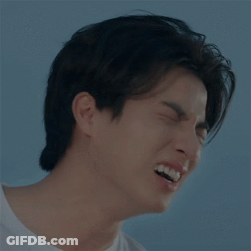 A Close Up Of A Man 'S Face With His Mouth Open GIF