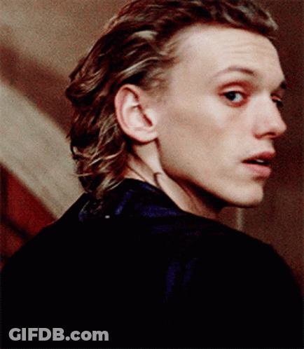 A Close Up Of A Man 'S Face With His Mouth Open GIF