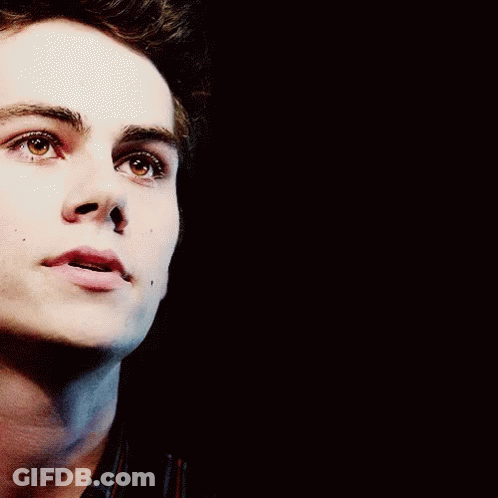 A Close Up Of A Man 'S Face With His Mouth Open GIF