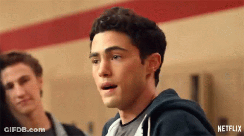 A Close Up Of A Man 'S Face With His Mouth Open In A Locker Room . GIF