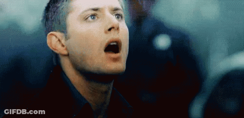 A Close Up Of A Man 'S Face With His Mouth Open Looking Up . GIF