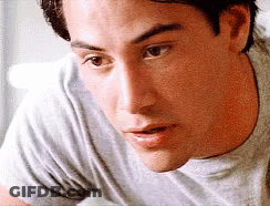A Close Up Of A Man 'S Face With His Mouth Open GIF