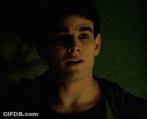 A Close Up Of A Man 'S Face With His Mouth Open GIF