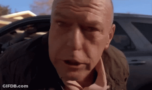 A Close Up Of A Man 'S Face With His Mouth Open GIF