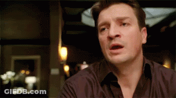 A Close Up Of A Man 'S Face With His Mouth Open . GIF
