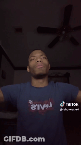 A Close Up Of A Man 'S Face With His Tongue Out And A Tiktok Watermark GIF