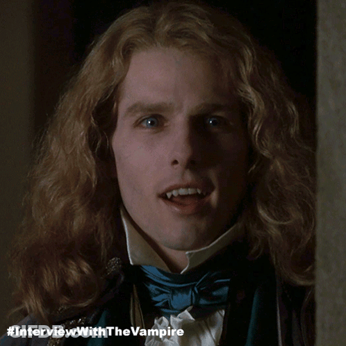 A Close Up Of A Man 'S Face With #Interviewwiththevampire Written Below Him GIF