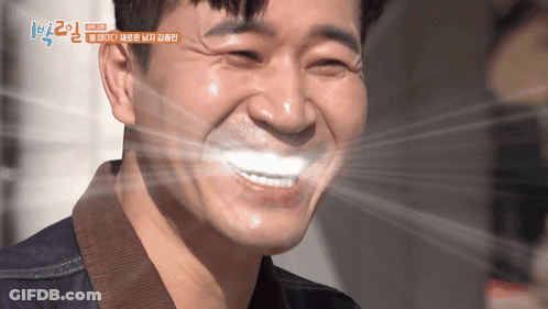 A Close Up Of A Man 'S Face With Korean Writing On The Bottom GIF