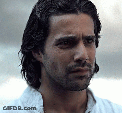 A Close Up Of A Man 'S Face With Long Hair And A Beard . GIF