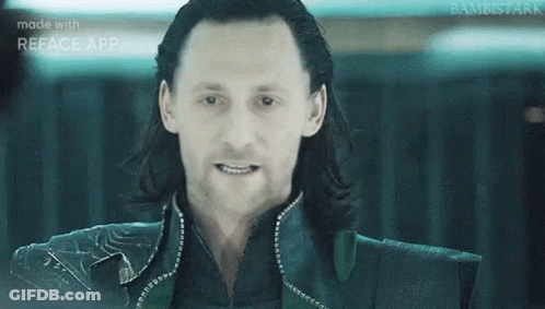 A Close Up Of A Man 'S Face With Long Hair And A Smile . GIF