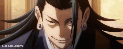 A Close Up Of A Man 'S Face With Long Hair And Blue Earrings GIF