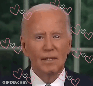 A Close Up Of A Man 'S Face With Pink Hearts Around It GIF