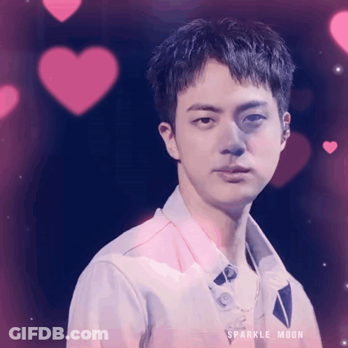 A Close Up Of A Man 'S Face With Pink Hearts Behind Him And The Words Sparkle Moon On The Bottom GIF