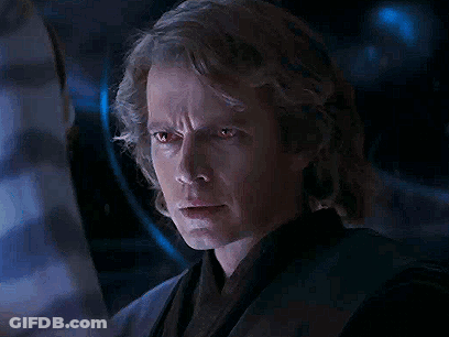 A Close Up Of A Man 'S Face With Red Eyes Looking At Something . GIF