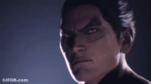 A Close Up Of A Man 'S Face With Red Eyes Looking At The Camera GIF