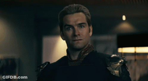 A Close Up Of A Man 'S Face With Red Eyes Looking At The Camera GIF