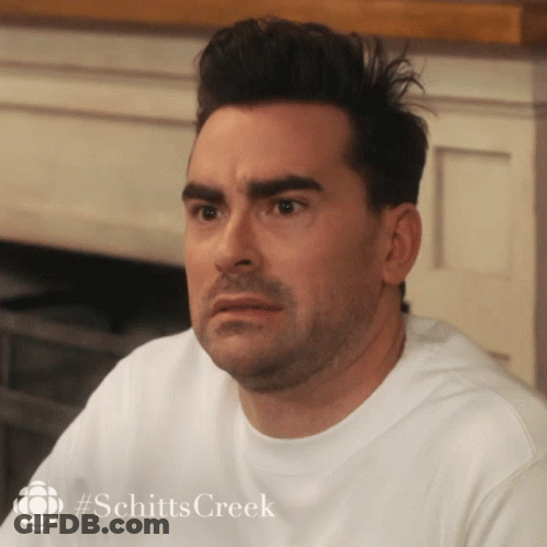 A Close Up Of A Man 'S Face With #Schitts Creek On The Bottom GIF
