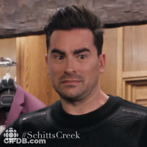 A Close Up Of A Man 'S Face With #Schitts Creek Written On It GIF